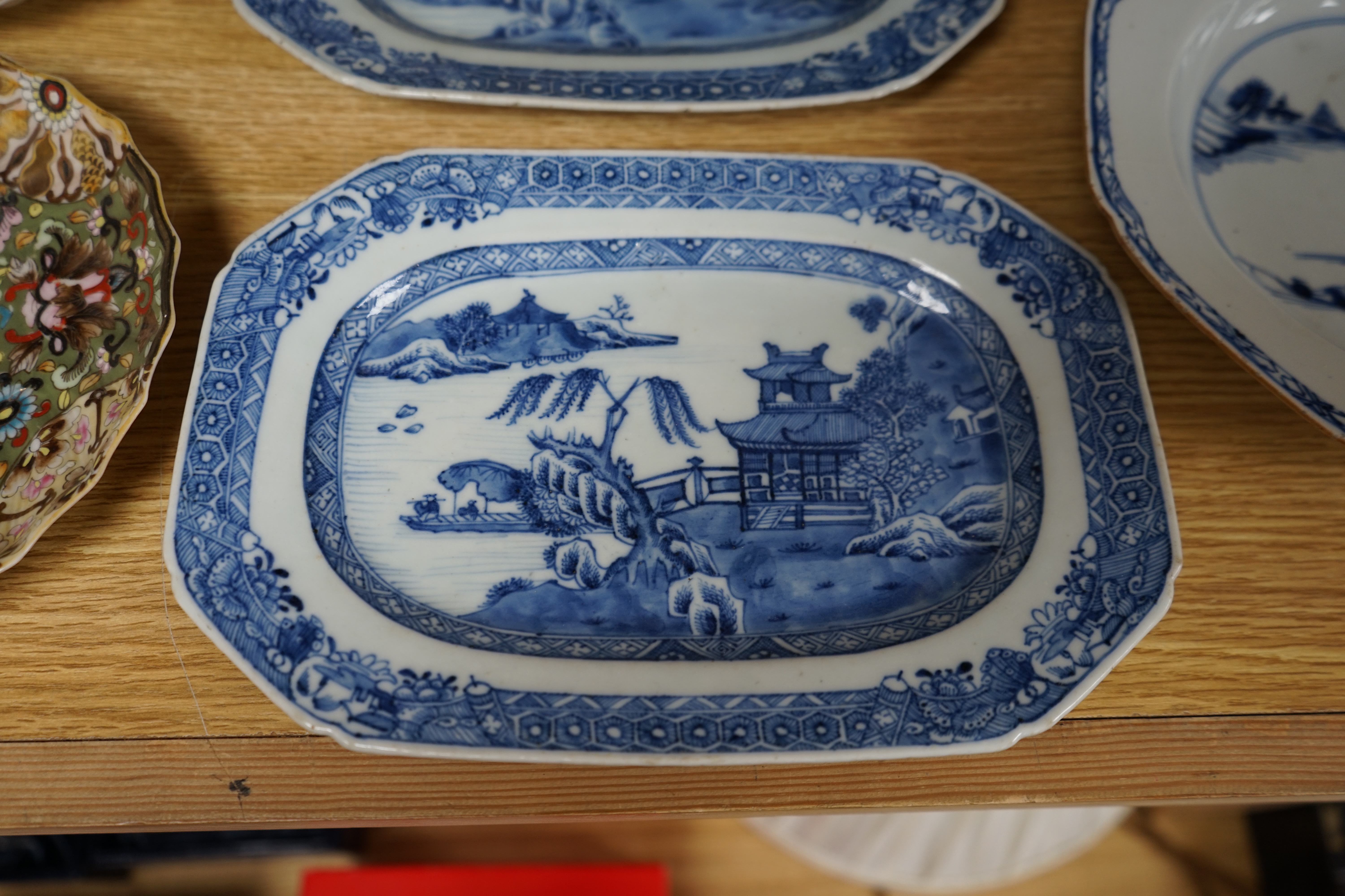 A quantity of Chinese and Japanese porcelain to include blue and white bowls, famille rose tea bowls and a pair of late 19th century dishes (18). Condition - varies, poor to fair